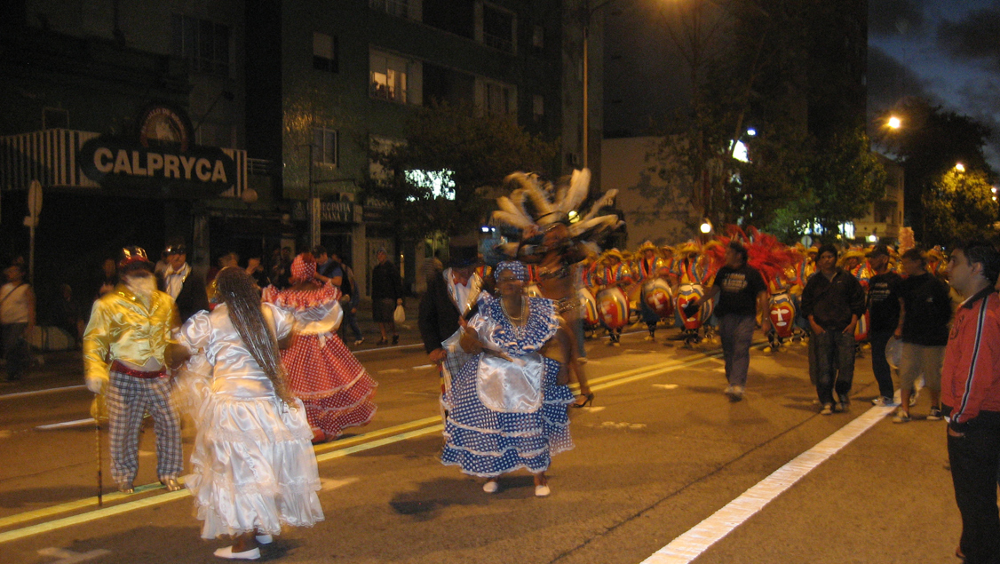 Candombe drummers and other participants on a street in Montevideo.