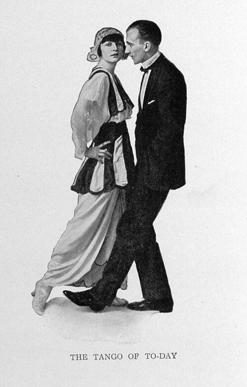 Irene and Vernon Castle pose in an upright dance hold in a black and white illustration from Modern Dancing.